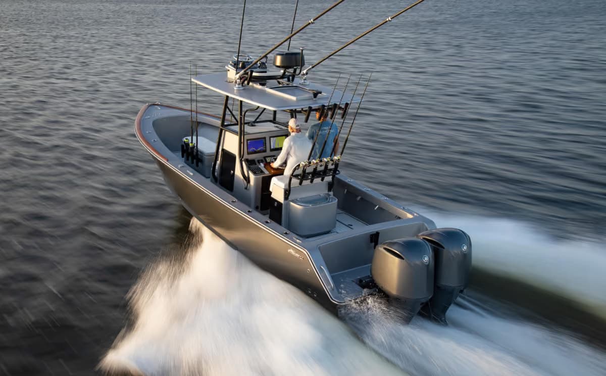 Grey Stuart 27 with twin outboards running through open water