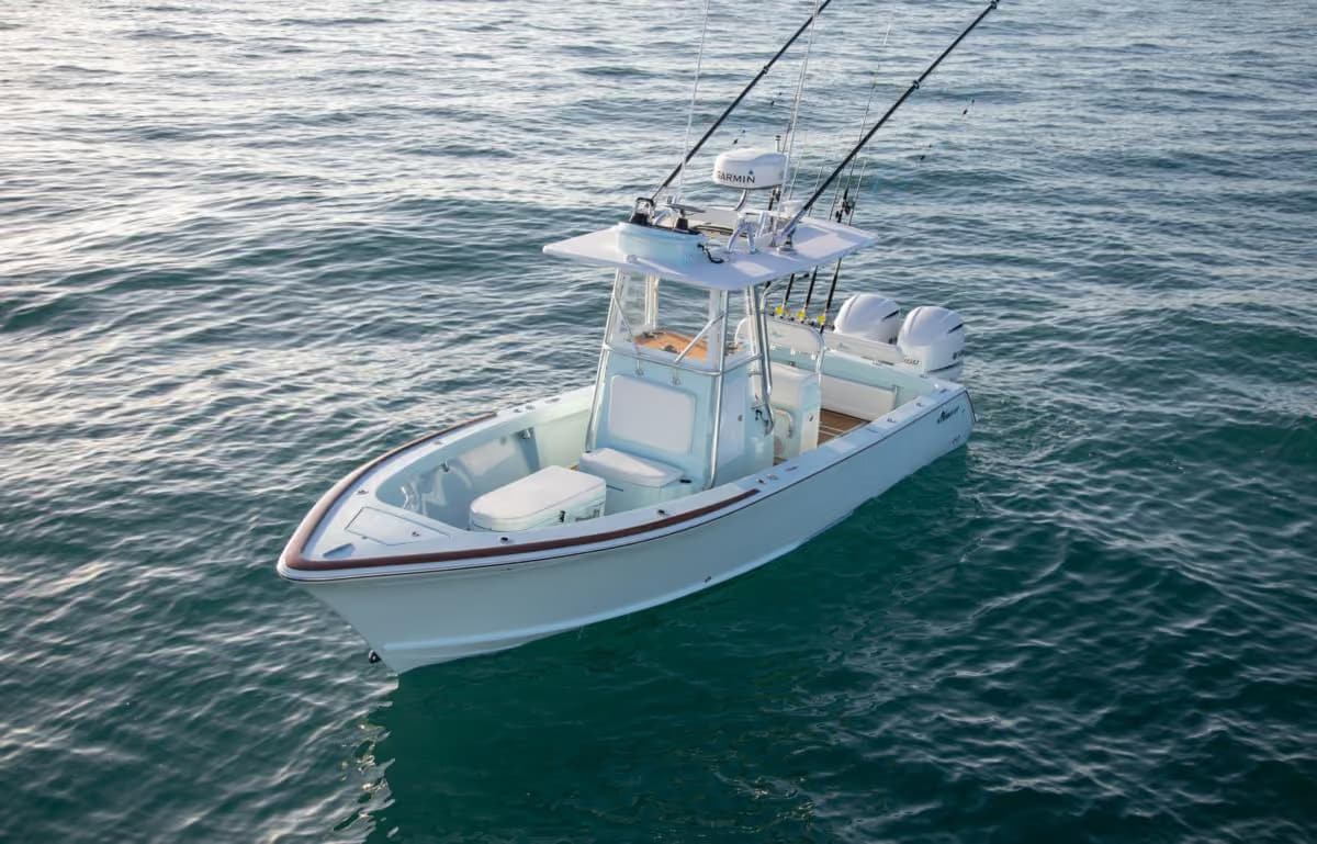 White Stuart 27 cruising over turquoise water